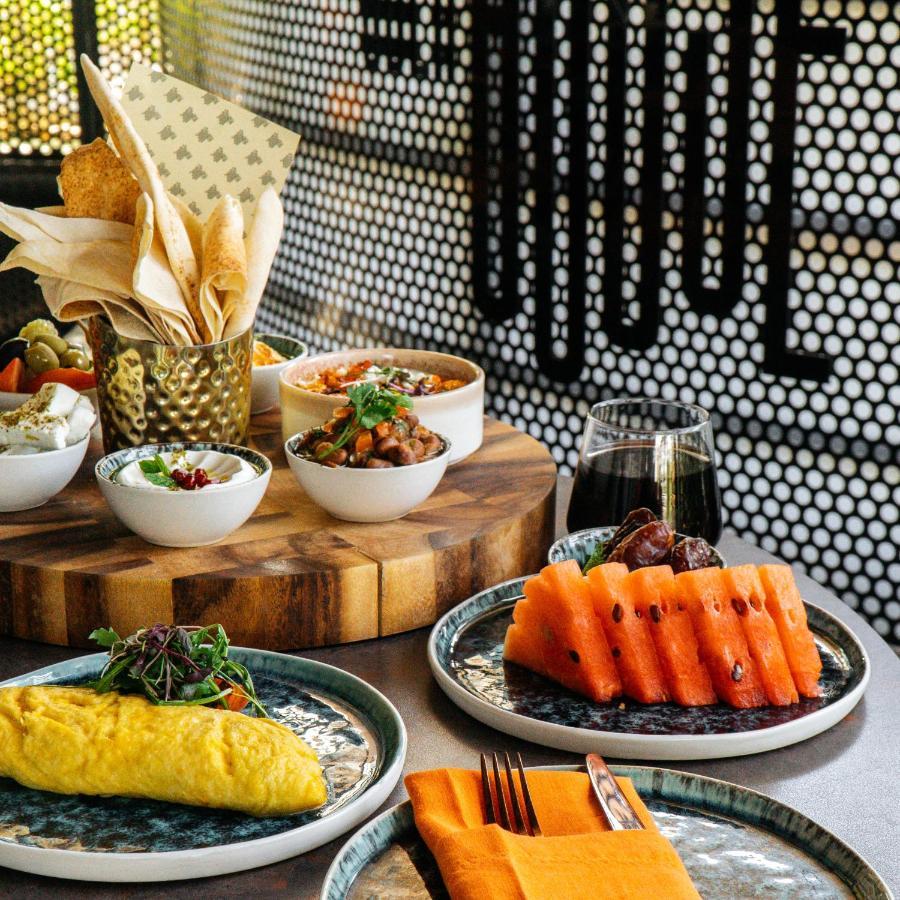 Somerset West Bay Doha Dış mekan fotoğraf A selection of dishes at the restaurant